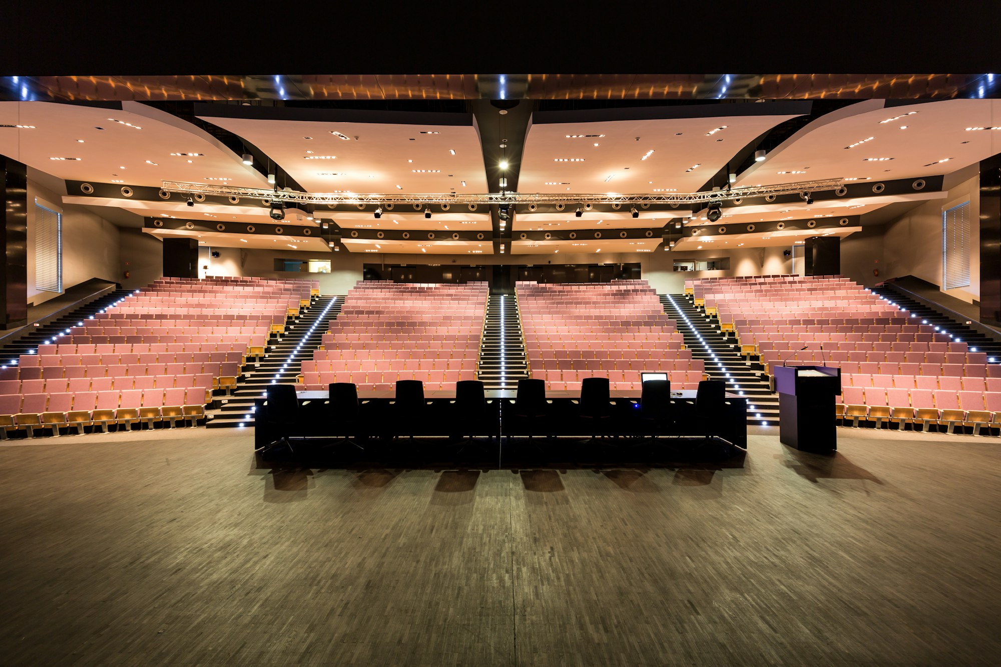 Auditorium with long table and podium